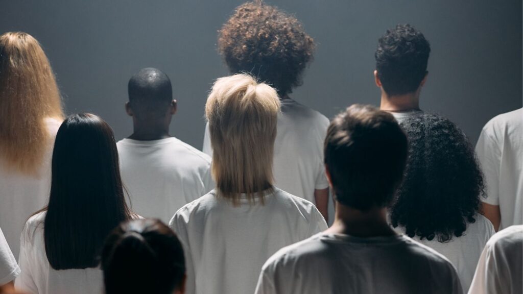 Ominous back view of diverse people and hair textures.