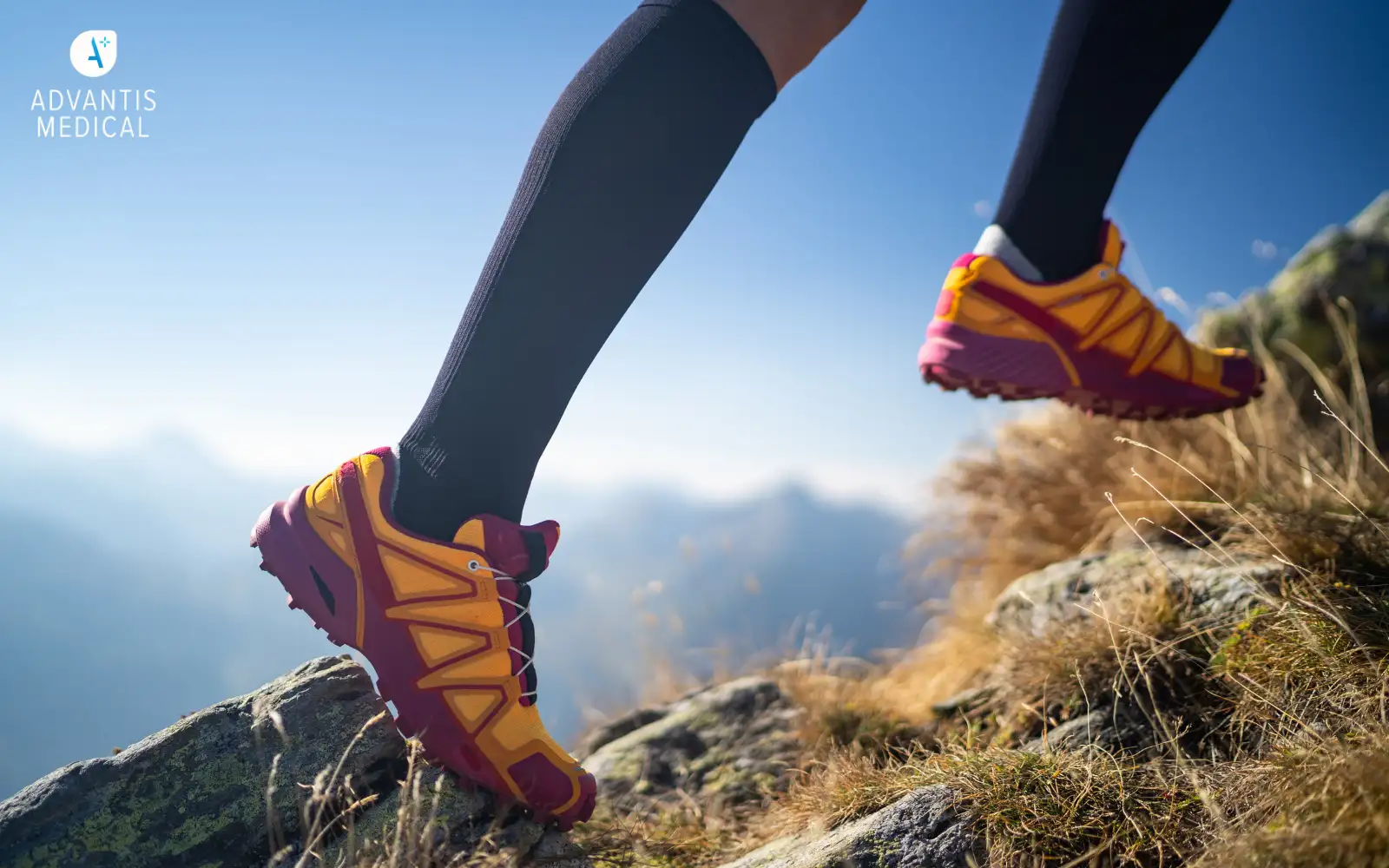 Travel nurse wearing black compression socks that were gifted and running up a hill outdoors.
