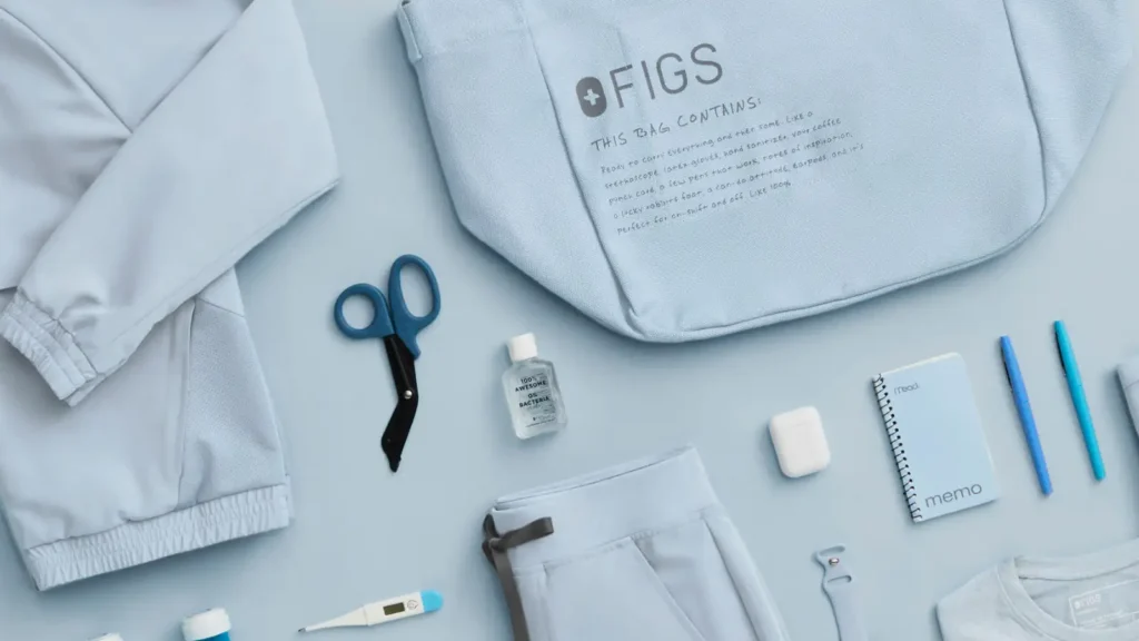 Female nurse wearing FIGS scrubs during hospital shift. Find FIGS scrubs near me.