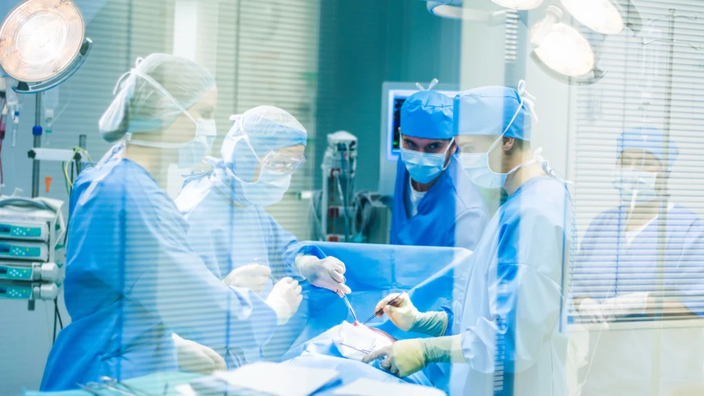 OR techs preparing surgical instruments in a modern operating room