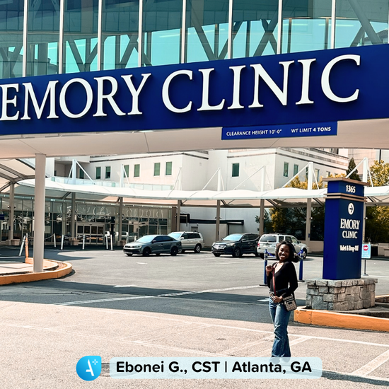 Travel nurse standing outside a hospital in Atlanta, Georgia, ready to begin a new assignment. The hospital entrance and signage are visible in the background, capturing the start of a travel nursing job in Georgia.